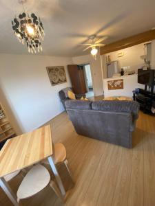 a living room with a couch and a table at Cardiff Bay Apartment in Cardiff