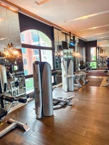 a gym with treadmills and machines in a room at Espana Condo Resort Pattaya F108 in Jomtien Beach