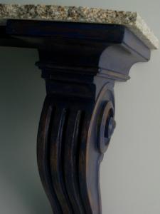 a close up of a wooden table with a marble top at Villa Spozendus in Esposende