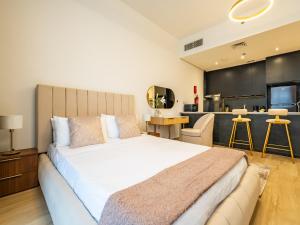 Postel nebo postele na pokoji v ubytování Comfy and stylish Studio in Regina Towers - JVC + 22 fotografií