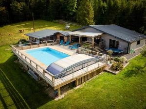 an aerial view of a house with a swimming pool at Chalet Luxe et Nature in Anould