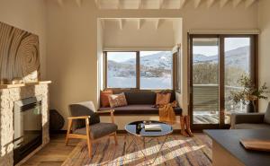 a living room with a couch and a fireplace at Studio Loft 18 - The Stables Perisher in Perisher Valley