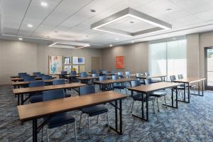 a classroom with tables and chairs in a room at Holiday Inn Express Atlanta Airport - North, an IHG Hotel in Atlanta