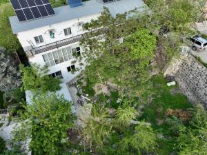 an overhead view of a building with a yard with trees at Cosy Studio with Beautiful Garden in Yerevan