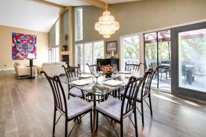 a dining room with a glass table and chairs at Pet-Friendly Pennsylvania Abode - Deck and Fireplace in Gibsonia
