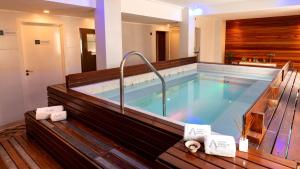 a large swimming pool in a house at Hotel Riviera in Mar del Plata +60 photos