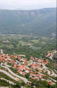 an aerial view of a town with a road and houses at Άγρια Λούλουδα Κατοικία Ευτυχία in Timfristós