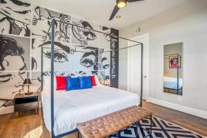 a bedroom with a canopy bed with a mural at Luxury Downtown Home w Rooftop Deck in the Skyline in Houston