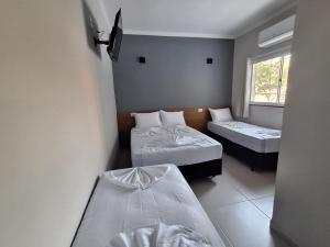 Ένα ή περισσότερα κρεβάτια σε δωμάτιο στο Hotel Supremo