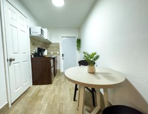 a small table in a room with a kitchen at 2 Q Studio Apt With Shared Pool 510 in Clearwater