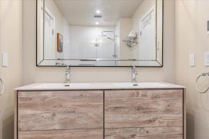 a bathroom with a sink and a large mirror at Starry Nights - River Wineries Huge Fenced Yard in Forestville +27 photos