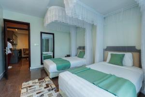 Postel nebo postele na pokoji v ubytování Koki Hotel + 37 fotografií