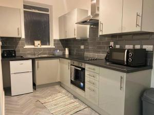 Kuchyň nebo kuchyňský kout v ubytování Bridgewater Flat