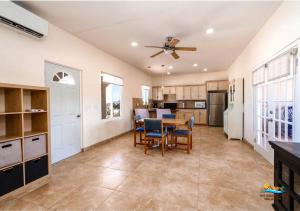 a kitchen and dining room with a table and chairs at Casa Desert Rose - Gated Community San Felipe Vacation Rental Home in Playa Hawaii