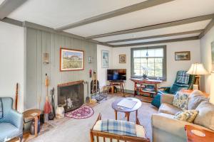 a living room with a couch and a fireplace at Tranquil 3 BR Stockbridge House with Private Deck! in Stockbridge
