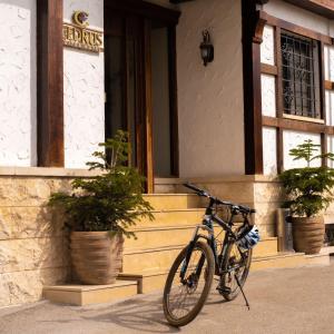 a bike parked in front of a building at Le Cedrus Hotel in Al Arz