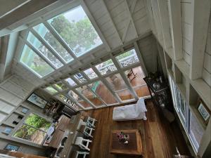 an overhead view of a living room with windows at Los Secretos Guesthouse in Bocas Town