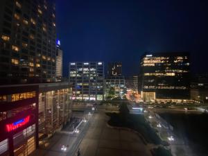 a view of a city at night with buildings at Platinum Towers great view balcony 1 bedroom in Warsaw