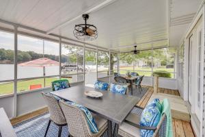 a dining room with a table and chairs at Lake Martin Retreat with Private Dock and Boat Launch in Dadeville