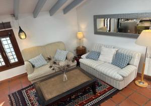 a living room with two couches and a coffee table at Casa Pier in Altea