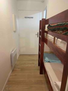 a hallway with two bunk beds in a room at Studio lumineux - Départs de randonnées in Laruns +10 photos