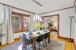 a dining room with a table and chairs at King Bed-Full Kitchen-Self Check-In-Parking-UofR in Rochester