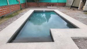 a pool of water sitting in a backyard at VICTORIA ANDINA I in Salta