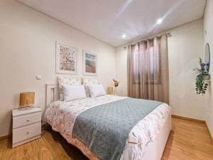 Ένα ή περισσότερα κρεβάτια σε δωμάτιο στο Casa Cais Novo