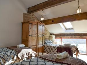 a bedroom with two beds and a window at High Gate - Uk30579 in Nelson