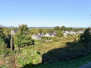 a view of a village with houses on a hill at Janvalyn in Tregarth