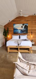 Postel nebo postele na pokoji v ubytování Bombua Beach House