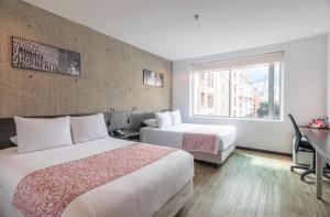 Postel nebo postele na pokoji v ubytování Hotel B3 Virrey