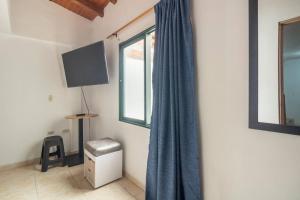 TV a/nebo společenská místnost v ubytování Letto Hostal