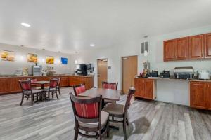 a kitchen and dining room with a table and chairs at Comfort Suites Lake Geneva East in Lake Geneva