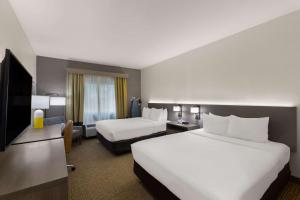 Кровать или кровати в номере Comfort Inn & Suites ATX North
