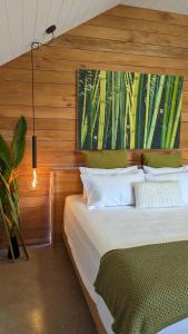 Postel nebo postele na pokoji v ubytování Bombua Beach House