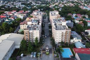 an aerial view of a city street with buildings at 1 BR Condo in East BelAir Residence Cainta Rizal with parking in Manila