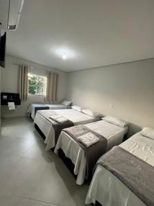 En eller flere senge i et værelse på Hotel San Lucas