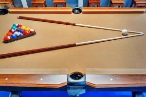 a pool table with cue balls on top of it at Vacation Villa W Heated Pool Beach & Casino in Hollywood