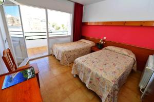 Postel nebo postele na pokoji v ubytování Hostal Magnolia + 28 fotografií