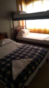 Giường trong phòng chung tại Hotel Los Estoraques