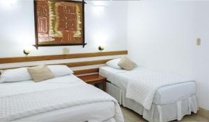 Cama o camas de una habitación en Hotel Casa Amelia
