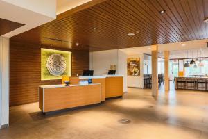 a lobby with a reception desk in a building at Fairfield Inn & Suites Marquette in Marquette