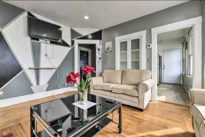 a living room with a couch and a table at downtown and secluded in Manchester