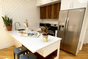 a kitchen with a refrigerator and a white counter top at Cozy Bedroom - Shared Kitchen & Living room - Brooklyn Townhouse - 25min Manhattan in Brooklyn