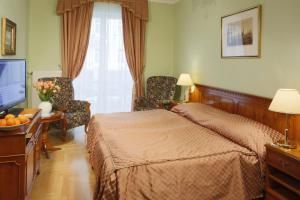 Posteľ alebo postele v izbe v ubytovaní Hotel Bristol