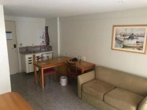 a living room with a couch and a table at Cond Blue Tree Towers in Fortaleza