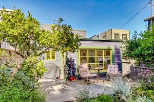 a patio with two chairs and a table at Bernal Heights Spacious 3br Oasis Walk Score 96 in San Francisco