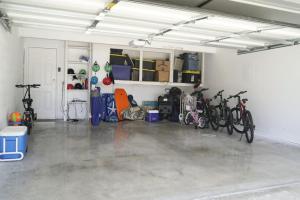 a garage with a bunch of bikes parked in it at Endless Sunset- Near Beach Surf and Pet Friendly in Huntington Beach