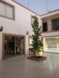 a christmas tree in the middle of a building at Los Arcos Hottel Boutique in Morelia